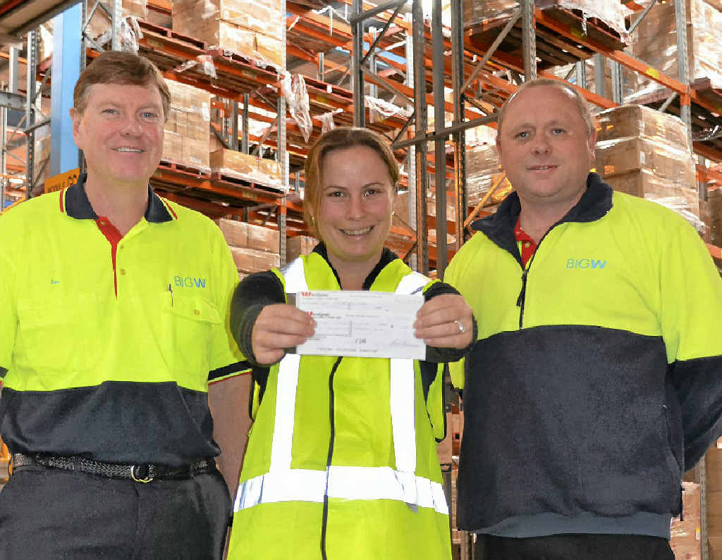 Big W DC HR manager Ian Jamieson and acting DC manager Scott Grady hand over a cheque to CareFlight’s Suzie Washington, one of the many charities they support. Big W DC HR manager Ian Jamieson and acting DC manager Scott Grady hand over a cheque to CareFlight’s Suzie Washington, one of the many charities they support.